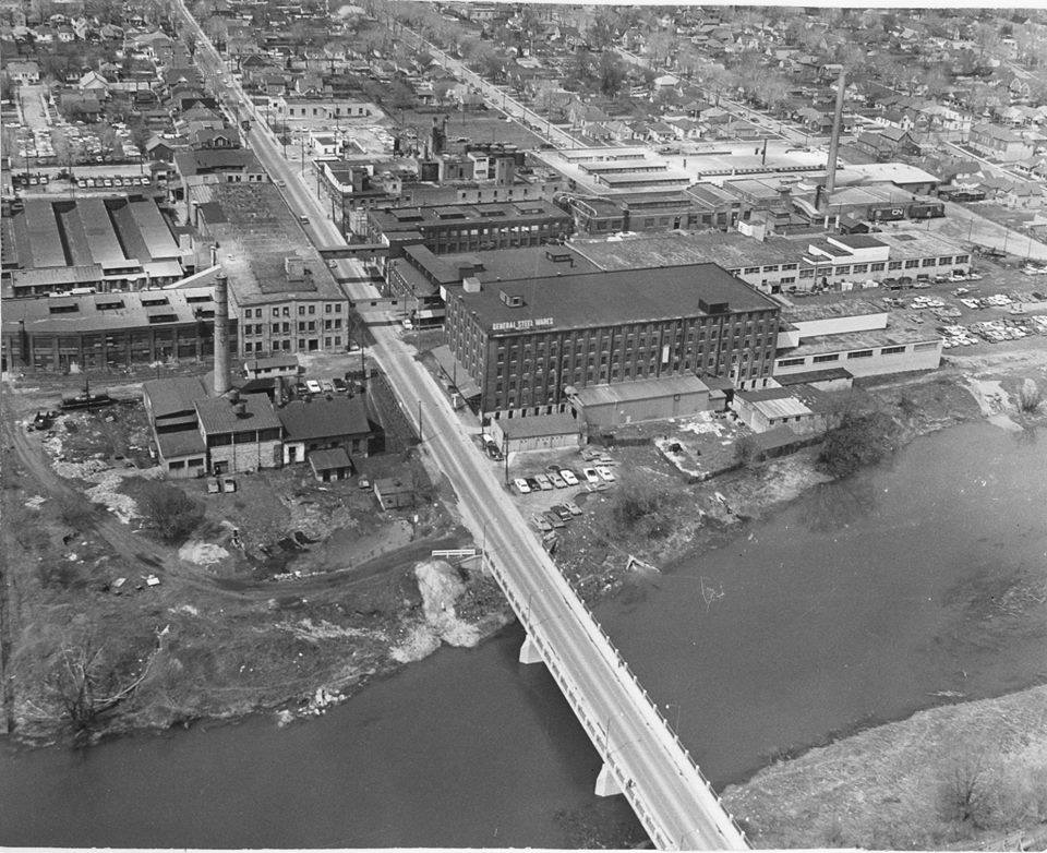 Black and white aerial view of the General Steel Wares complex on Adelaide Street and along the south branch of the Thames river